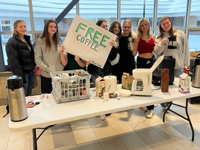 Eco club members handing out coffee