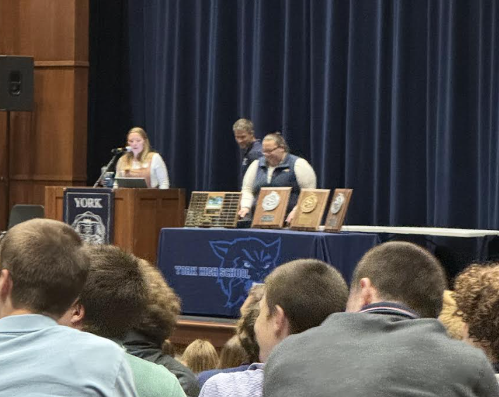 Lindsay rivers giving a speech about the recipients of the special awards.